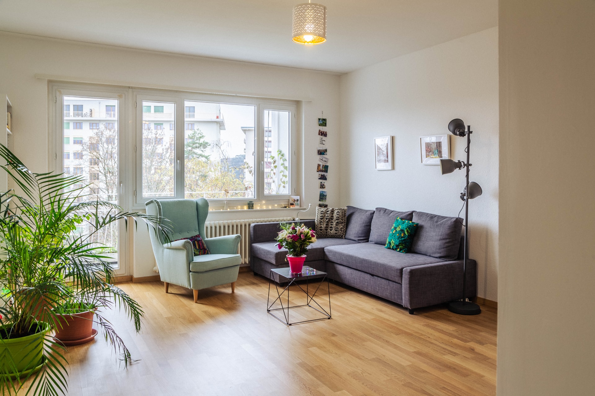 green sofa near glass window